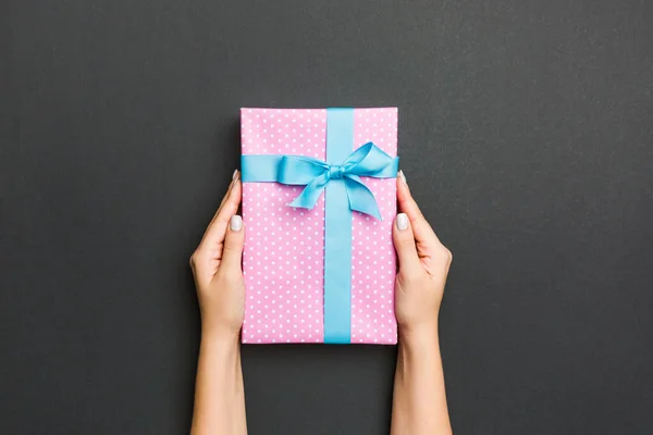 Top view of female hands holding christmas or other holiday hand — Stock Photo, Image