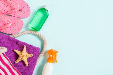 Summer bag background with copy space. Flat lay photo on color t