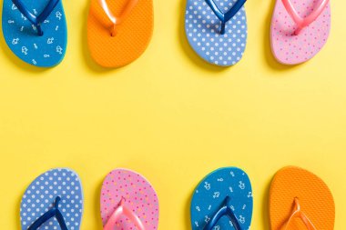 a lot of flip flop colored sandals, summer vacation on colored b