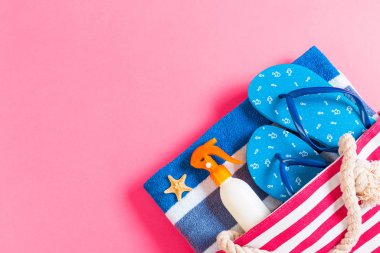 Summer bag background with copy space. Flat lay photo on color t