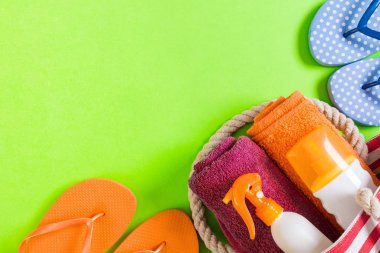 Summer bag background with copy space. Flat lay photo on color t