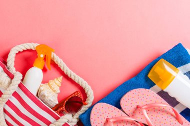 Summer bag background with copy space. Flat lay photo on color t