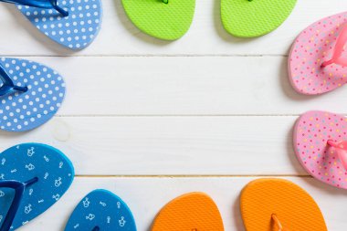 a lot of flip flop colored sandals, summer vacation on wooden ba