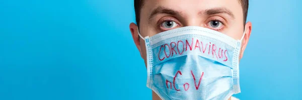 Portrait Young Sick Man Medical Mask Coronavirus Ncov Word Blue — 스톡 사진