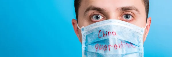 Portrait Young Man Wearing Medical Mask China Quarantine Word Blue — 스톡 사진