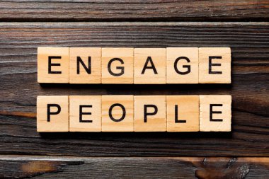 ENGAGE PEOPLE word written on wood block. ENGAGE PEOPLE text on wooden table for your desing, concept. clipart