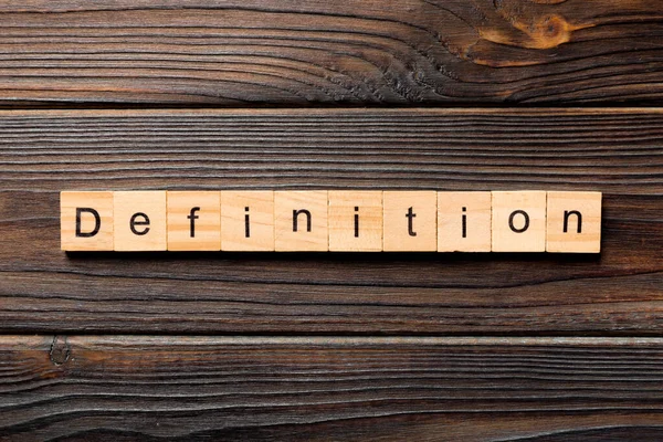 Definitionswort Auf Holzblock Geschrieben Definitionstext Auf Holztisch Für Ihre Gestaltung — Stockfoto