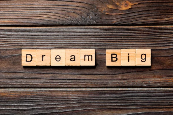 Dream big word written on wood block. Dream big text on wooden table for your desing, Top view concept.