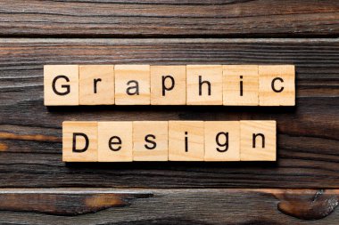 grafik tasarım kelime ahşap blok üzerinde yazılı. grafik tasarım metin, tasarım, ahşap masanın kavramı.