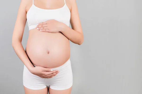 Snímek Těhotné Ženy Bílém Spodním Prádle Držící Její Břicho Šedém — Stock fotografie