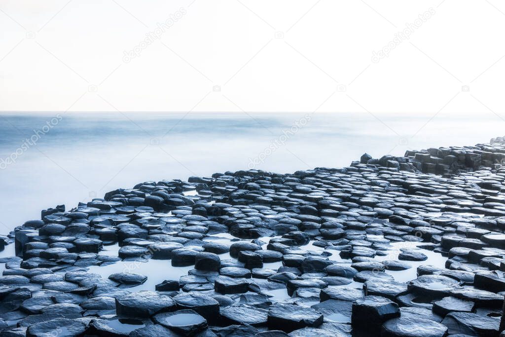 Beautiful view on morning day sunrise waves Giant's Causeway Northern Ireland NI