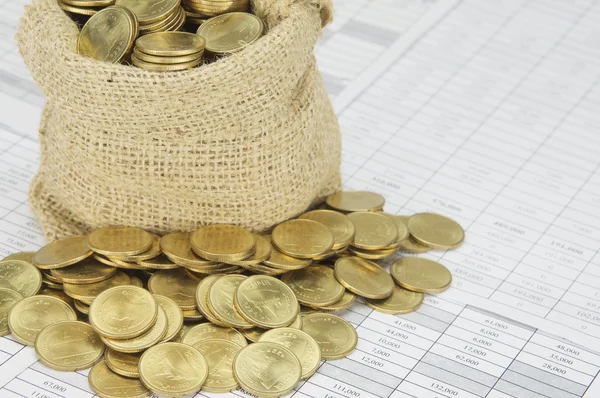 Close up stack of gold coins with sack of coins — Stock Photo, Image