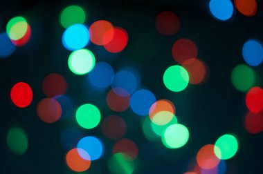 Arka plan olarak geceleri renkli bokeh yuvarlak