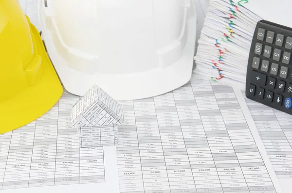 House have blur white and yellow engineer hat as background — Stock Photo, Image