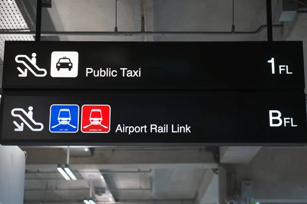 Public taxi and Airport rail link sign at international airport