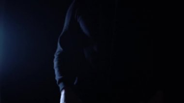 Close up. Street hooligan is holding a baseball bat.