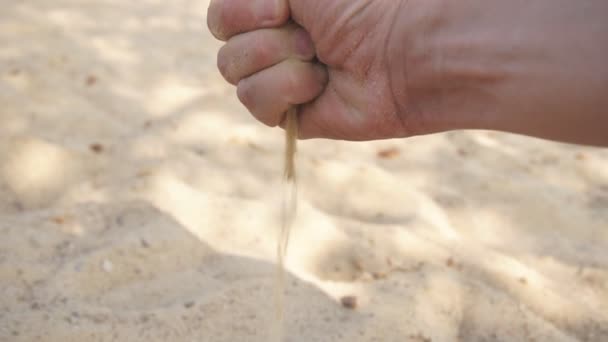The sand pours from the hands of slow motion, close up — Stock Video