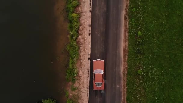 Aerial done view of vintage american car on the road — 비디오