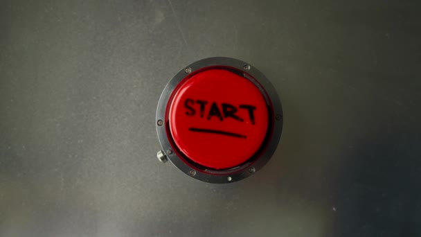 Finger presses the red button with the inscription start — Stock Video