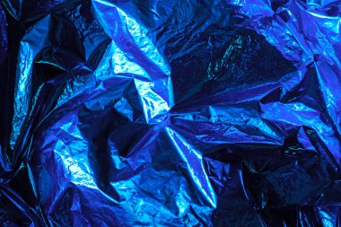 Parlak noel mavi arka planı. Parlak mavi folyo dokusu.