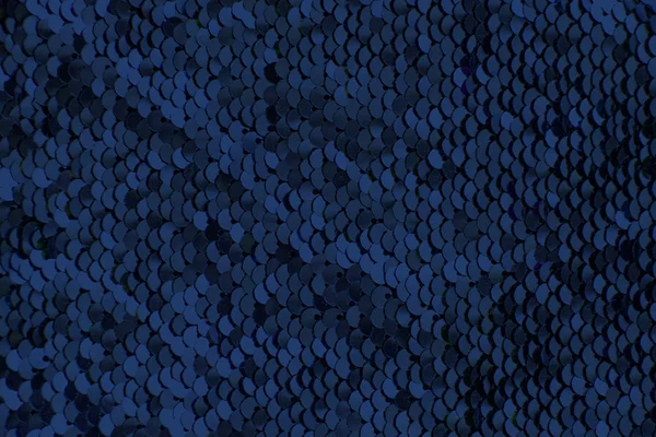 Trozos de tela con lentejuelas azules. Fondo de brillo. Textura de lentejuelas — Foto de Stock