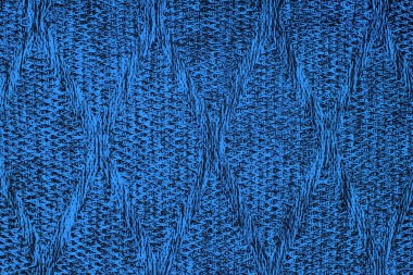 Arka plan olarak kablo desenli mavi yün örülmüş kumaş dokusu. Mavi doku.