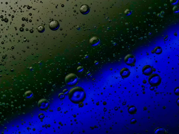 bubbles blowing up into a tough substance with a colored background