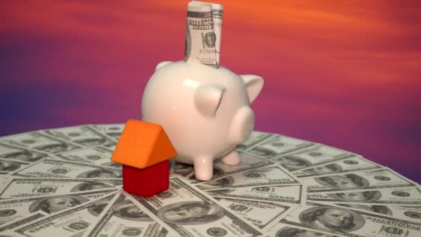 有美元钞票和小房子的小猪银行 — 图库视频影像