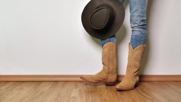 Cropped Shot Person Brown Leather Boots Holding Black Hat Wooden — Stock Video