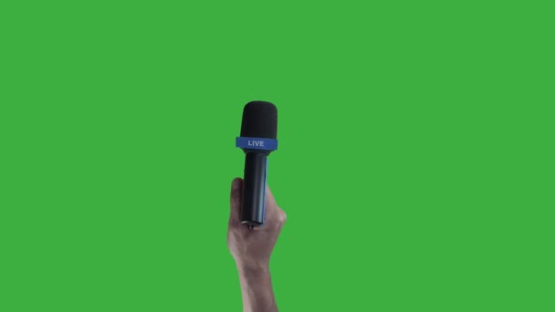 Cropped Shot Person Holding Microphone Hand Green Background — Stock Video