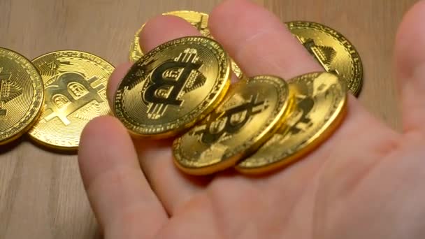 Cropped Shot Human Hand Bitcoins Falling Wooden Table — Stock Video