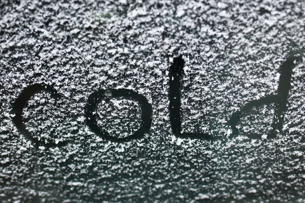 inscription on a snowy window