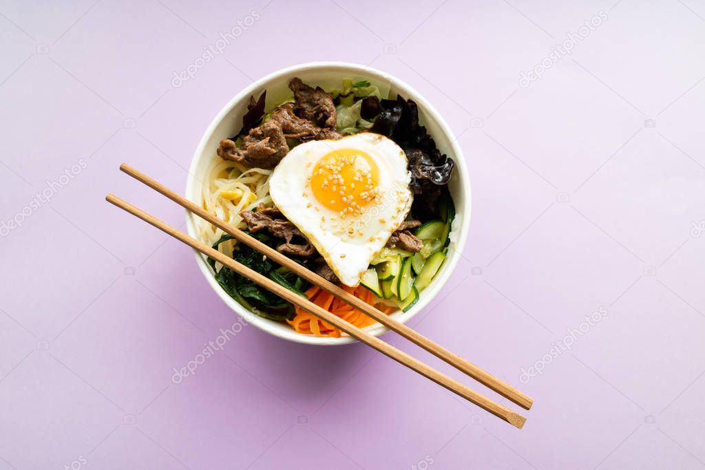 Bibimbap with rice, beef, wakame, egg, cucumber, carrot and so