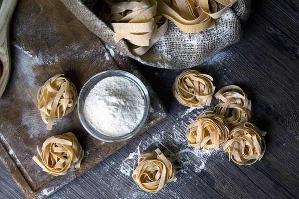 Raw homemade pasta and ingredients for pasta — Stock Photo, Image
