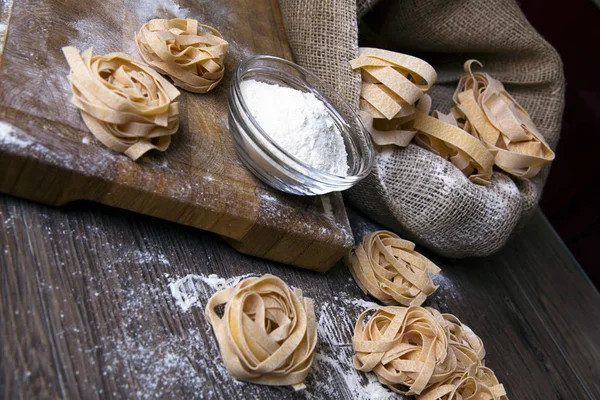 Raw homemade pasta and ingredients for pasta — Stock Photo, Image
