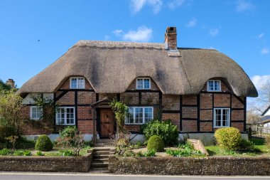 MICHELDEVER, HAMPSHIRE/UK - MARCH 21 : View of a Thatched Cottag clipart