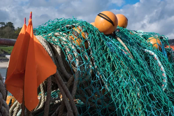 LYME REGIS, DORSET / UK - MARCH 22: Fishing Nets in the Harbour a — стоковое фото