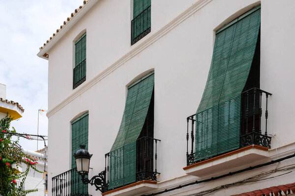 MARBELLA, ANDALUCIA/SPAIN - JULY 6 : Green Blinds over Balconies in the Old Town of Marbella Spain on July 6, 2017