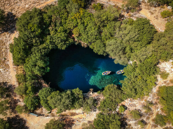 Tourist boat on the lake in Melissani Cave, Kefalonia Island, Greece
