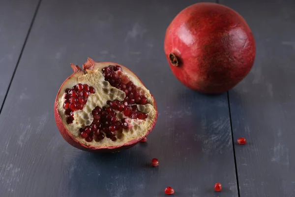 Pomegranate on blue background — Stock Photo, Image