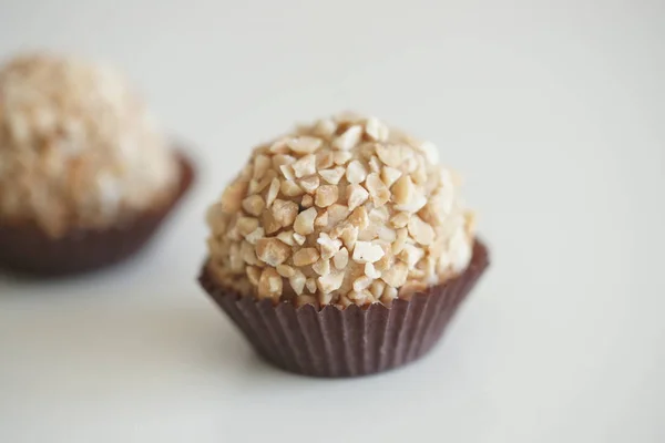 close up of tasty natural organic candies on white table background