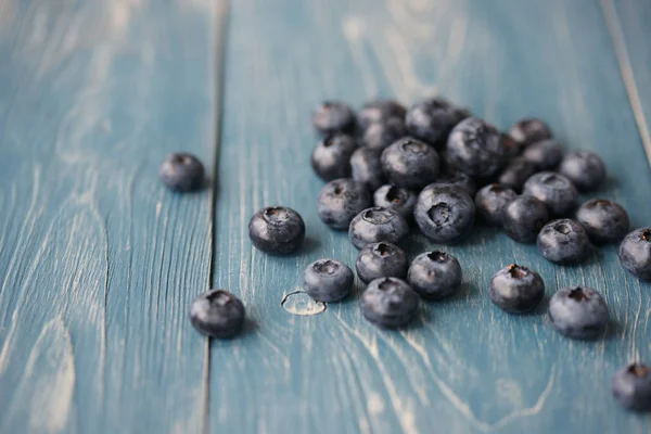 Lots Sprinkled Blueberries Blue Wooden Table — 스톡 사진