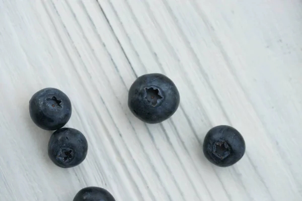 Lots Sprinkled Blueberries White Wooden Table — Stock Photo, Image