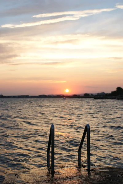 Beautiful Sunset Concrete Rocky Jetty Metal Steps Leading Sea — 图库照片