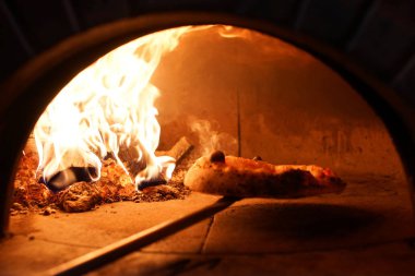 Neapolitan wood-fired pizza in  stove