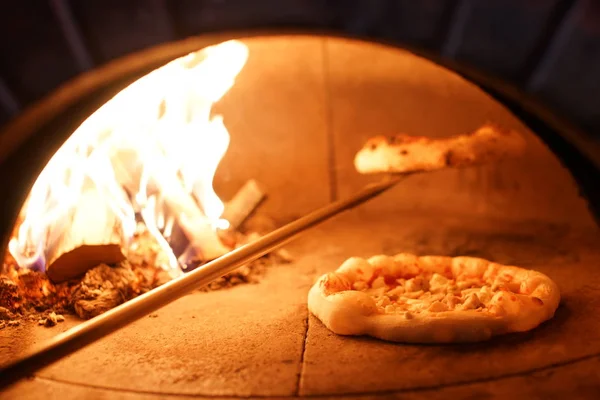 Neapolitan pizza cooked in a wood oven