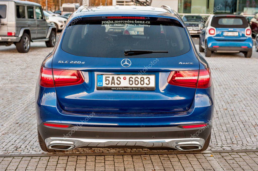 PRAGUE, THE CZECH REP., NOVEMBER 27, 2016: Rear view of luxury car Mercedes-Benz GLC 220d parking in front of car store Daimler.