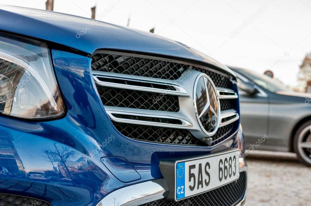 PRAGUE, THE CZECH REP., NOVEMBER 27, 2016: Closeup of front mask with logo of luxury car Mercedes-Benz GLC 220d parking in front of car store Daimler.