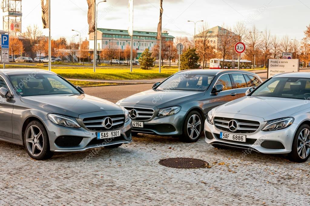PRAGUE, THE CZECH REP., NOVEMBER 27, 2016: Closeup of new luxury cars Mercedes-Benz c and e class parking in front of car store. Detail front view of cars