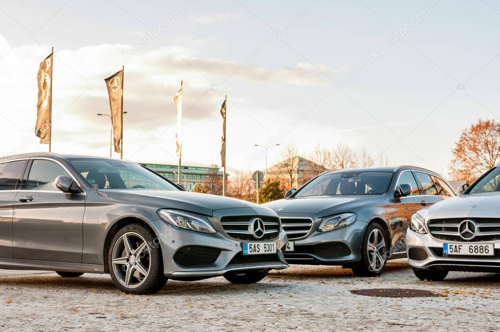 PRAGUE, THE CZECH REP., NOVEMBER 27, 2016: Closeup of new luxury cars Mercedes-Benz c and e class parking in front of car store. Detail front view of cars